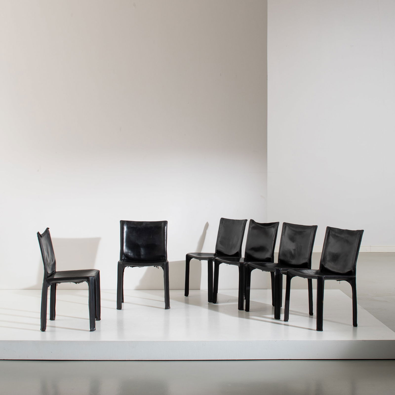 MARIO BELLINI: Sei sedie mod. CAB. Metallo verniciato, cuoio tinto. Produzione Cassina 1877 ca. cm 81x47x47 SIX CHAIRS BY M. BELLINI G. Bosoni, Made in Cassina, Skira, Milano 2008, pp. 226, 236 G. Gramigna, Repertor