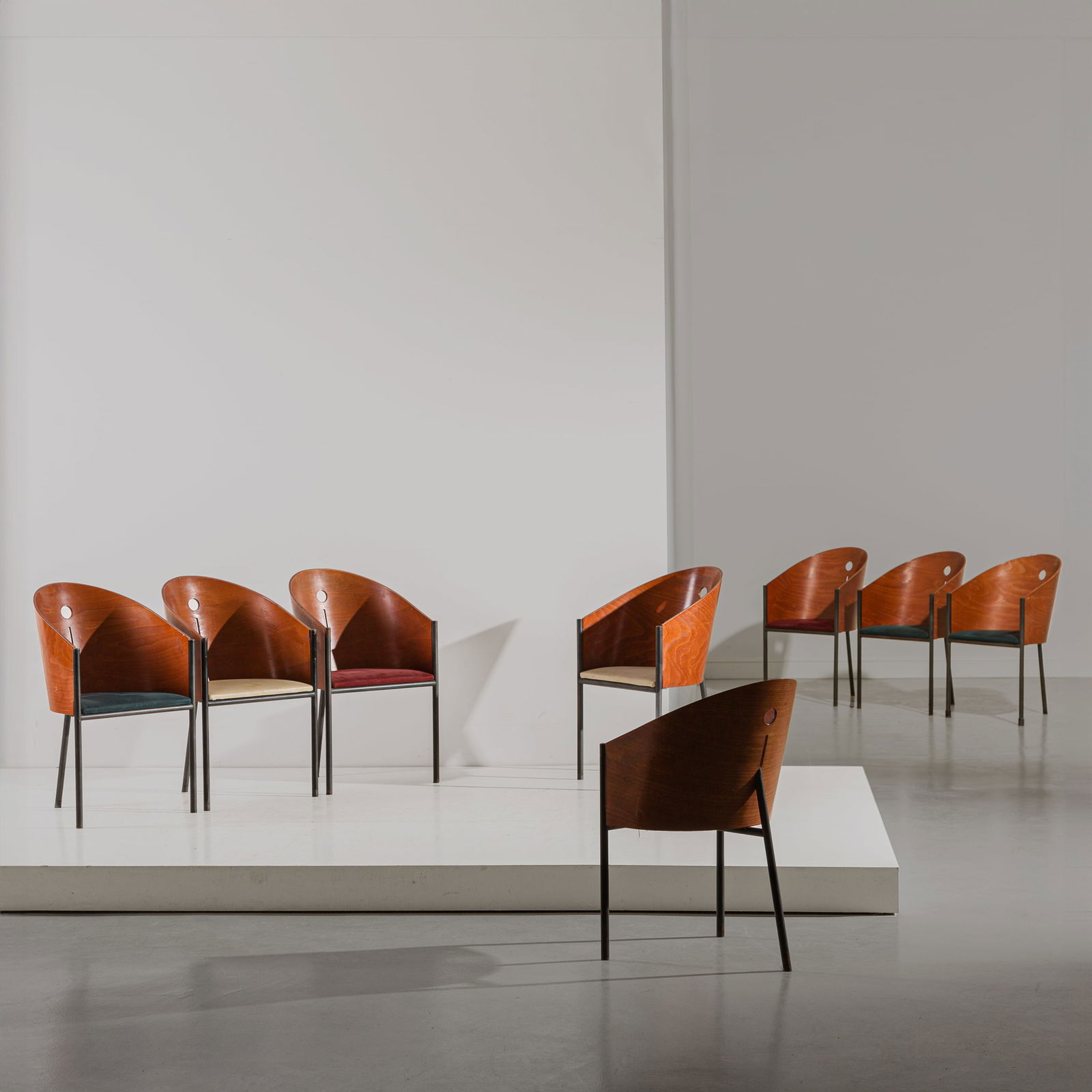 PHILIPPE STARCK : Otto poltroncine mod. Costes. Metallo verniciato, ottone brunito, multistrato curvato impiallacciato in legno esotico, vinilpelle e tessuto imbottiti. Produzione Driade, 1985 ca. cm 85x54x60. EIGHT CH