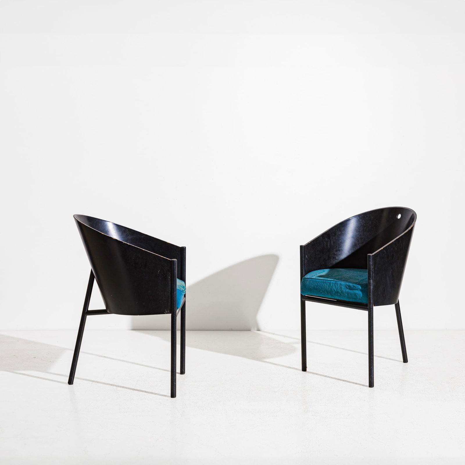 PHILIPPE STARCK: Due sedie mod. Costes. Metallo verniciato, legno curvato ebanizzato, tessuto imbottito. Produzione Driade, 1985 ca. cm 80x47,5x51 A PAIR OF CHAIRS BY P. STARCK C. & P. Fiell, 1000 chairs ed. Taschen,