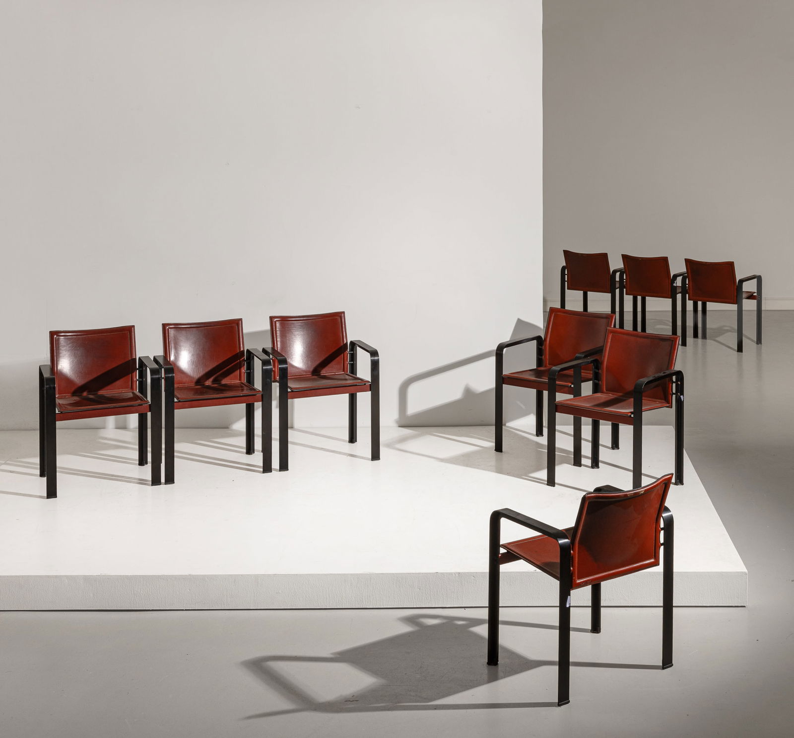 JACQUES TOUSSAINT & PATRICIA ANGELONI: Nove poltroncine. Metallo verniciato, pelle imbottita. Produzione Matteo Grassi anni '80. cm 78x57x52 NINE RAMCHAIRS BY J. TOUSSAINT & P. ANGELONI Buone condizioni generali. Piccole righe, leggeri gra