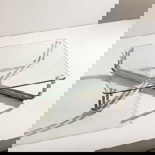 GIANFRANCO FRATTINI: Tavolino mod.784. Acciaio cromato, cristallo molato. Produzione Cassina 1968. cm 32x100x100 A LOW TABLE BY G. FRATTINI Discrete condizioni generali. Righe, leggeri graffi, normali segni di usura. Crom