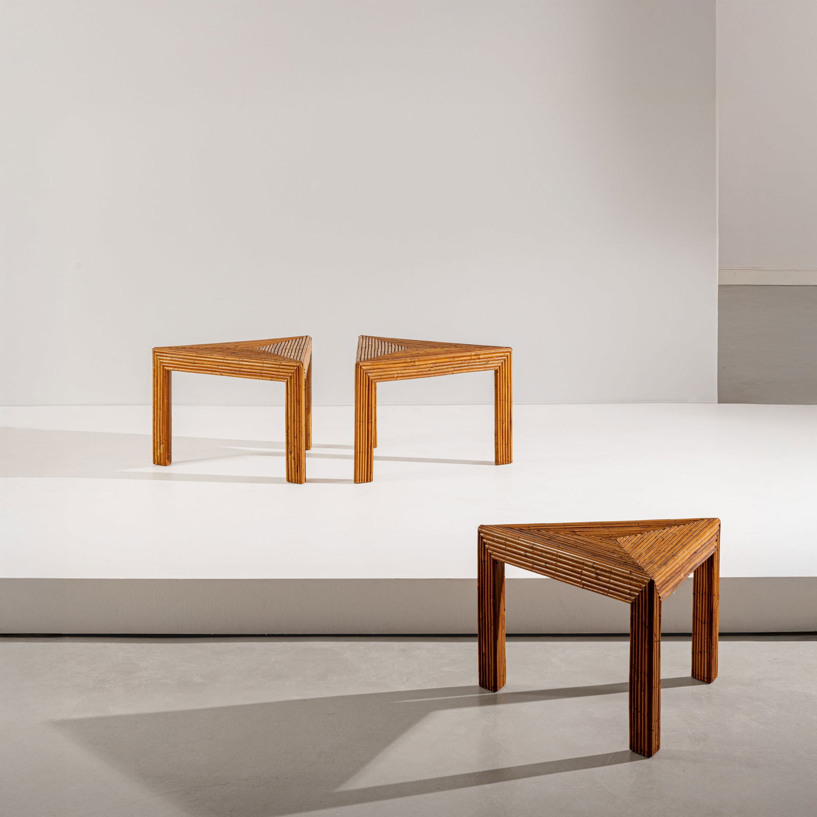 VIVAI DEL SUD: Tre tavolini. Legno rivestito in bamboo. Produzione Vivai del Sud anni '70. Timbro del produttore cm 40x60x52 THREE OCCASIONAL TABLES BY VIVAI DEL SUD Buone condizioni generali. Piccole righe,