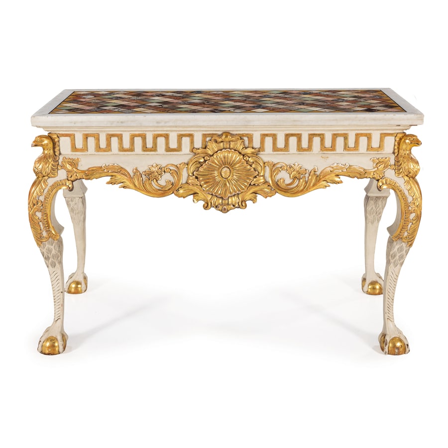 TAVOLO CONSOLE IN LEGNO INTAGLIATO, LACCATO E DORATO,: XX SECOLO in stile eclettico, ornato da ricchi fregi floreali lavorati a rilievo e dorati, gambe a doppia mossa su piede a sfera artigliata, fasce percorse da greca classica e teste rapaci agli angoli