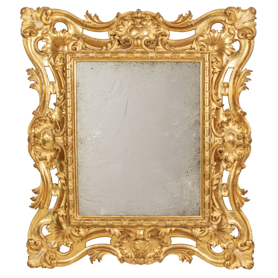 COPPIA DI CORNICI IN LEGNO INTAGLIATO E DORATO, XVIII: SECOLO montate a specchio, squadrate e ornate da grandi volute traforate con terminali a ricciolo, profilo interno bacellato; difetti, poche tracce di tarlo, restauri, mancanze nella doratura, gli