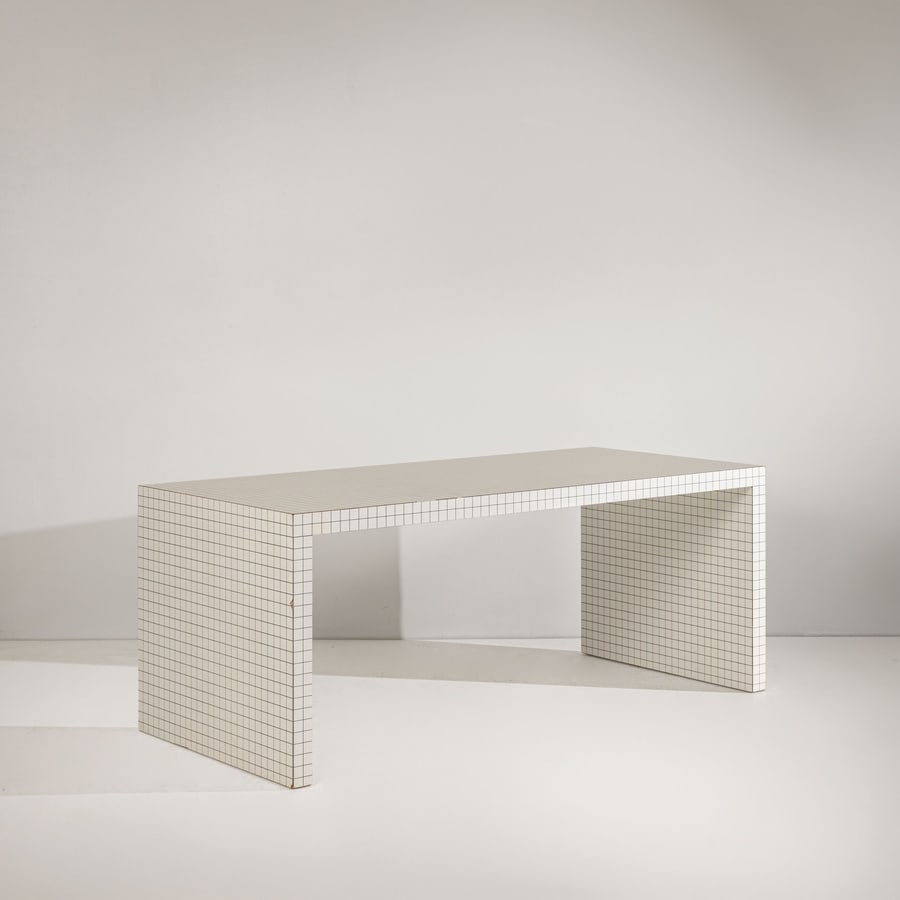 SUPERSTUDIO: Tavolo ; consolle della serie Quaderna. Legno nobilitato integralmente rivestito in formica serigrafata. Produzione Zanotta dal 1970 ca. cm 72x180x81 A TABLE ; CONSOLLE BY SUPERSTUDIO Domus n.7, 1970,