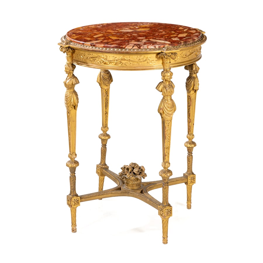 GUERIDON IN LEGNO SCOLPITO E DORATO, XIX SECOLO: di gusto neoclassico con piano in marmo incassato, montanti cimati da cariatidi e crociera riunita da cespo floreale; difetti, minori rotture e mancanze nei fregi, restauri, la crociera da fissare al 