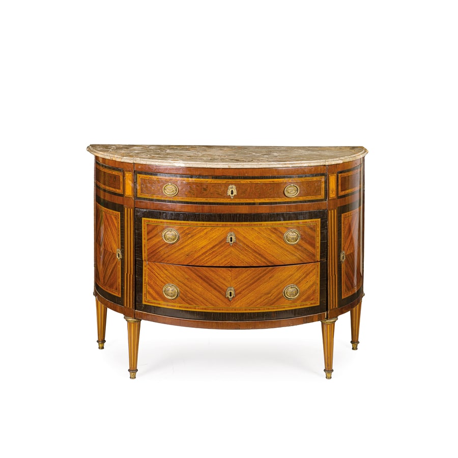 CASSETTONE A DEMILUNE IMPIALLACCIATO IN LEGNI VARI,: PIEMONTE, FINE DEL XVIII SECOLO interamente decorato da riserve geometriche filettate in legni anche tinti, due grandi cassetti e uno più piccolo sotto il piano in marmo, gambe troncoconiche con 