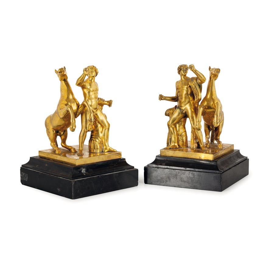 DUE GRUPPI IN BRONZO DORATO, XIX-XX SECOLO: rappresentanti figura mitologica con cavallo su base gradinata in marmo nero del Belgio- difetti, minori graffi e tracce di ossidazione, le basi in marmo da fissare e con sbeccature ai bordi Cm