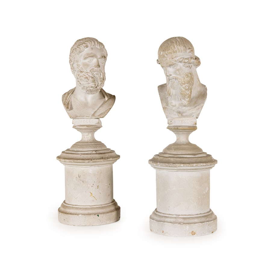 COPPIA DI PICCOLI BUSTI IN GESSO, ROMA, XIX SECOLO: raffiguranti Sofocle e Platone su base a plinto circolare; difetti, sbeccature e graffi, uno con restauro all'attaccatura del plinto, tracce di sporco Uno siglato Nelli Roma nel retro Cm 10X8,5 Att.