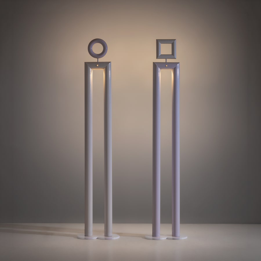 REMO BUTI: Due lampade da terra mod. Boy and Girl. Modello originariamete ideaito per show room Benetton. Metallo laccato, materiale plastico. Produzione Neofos, anni '80. cm 203x44x23 TWO FLOOR LAMPS BY R. BUTI