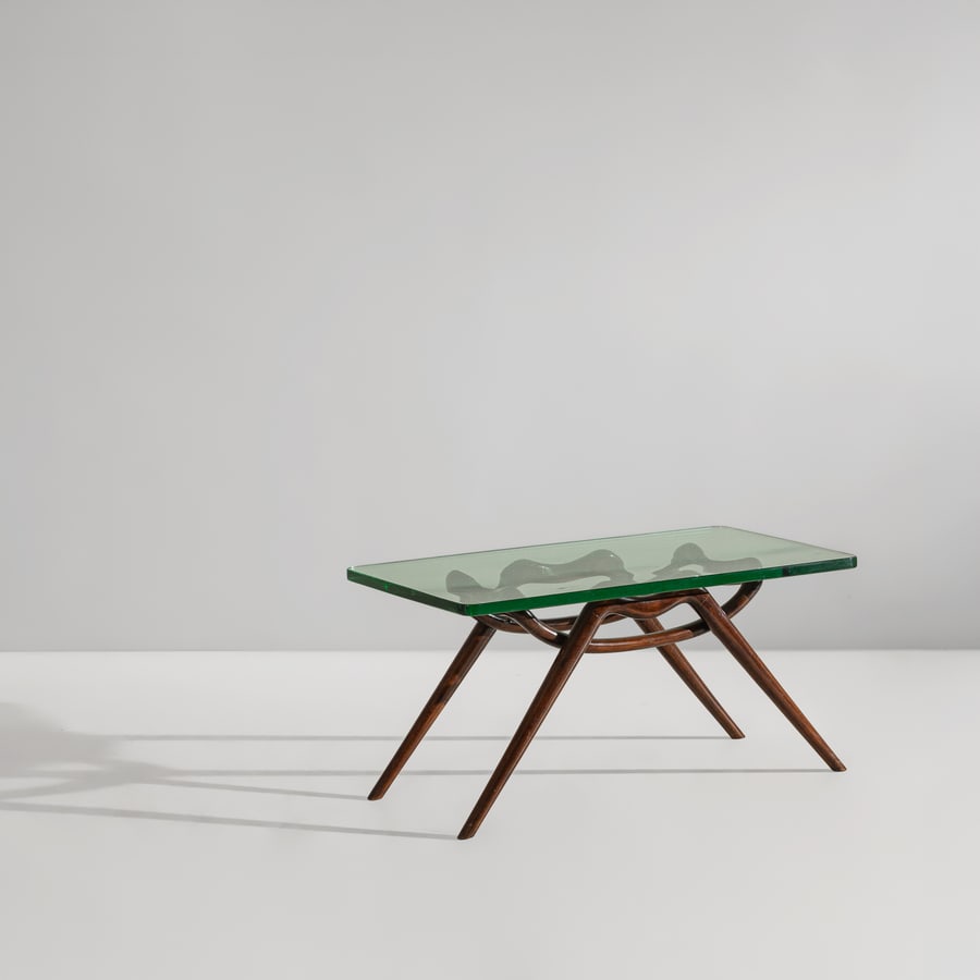 MANIFATTURA ITALIANA: Tavolino. Legno tinto, cristallo molato. Italia anni '50. cm 44x89x44,5 AN ITALIAN LOW TABLE Buone condizioni generali. Piccole righe, leggeri graffi, normali segni di usura. Struttura in legno recent