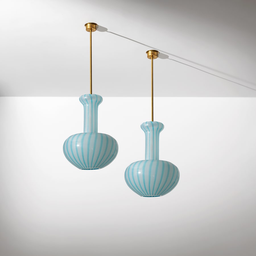 SLVIATI: Coppia di lampade a sospensione. Ottone, vetro opalino con inclusione di canne colorate. Murano, anni '70. cm 100x38x38 ca. A PAIR OF CEILING LAMPS BY SALVIATI Buone condizioni generali. Piccole righe