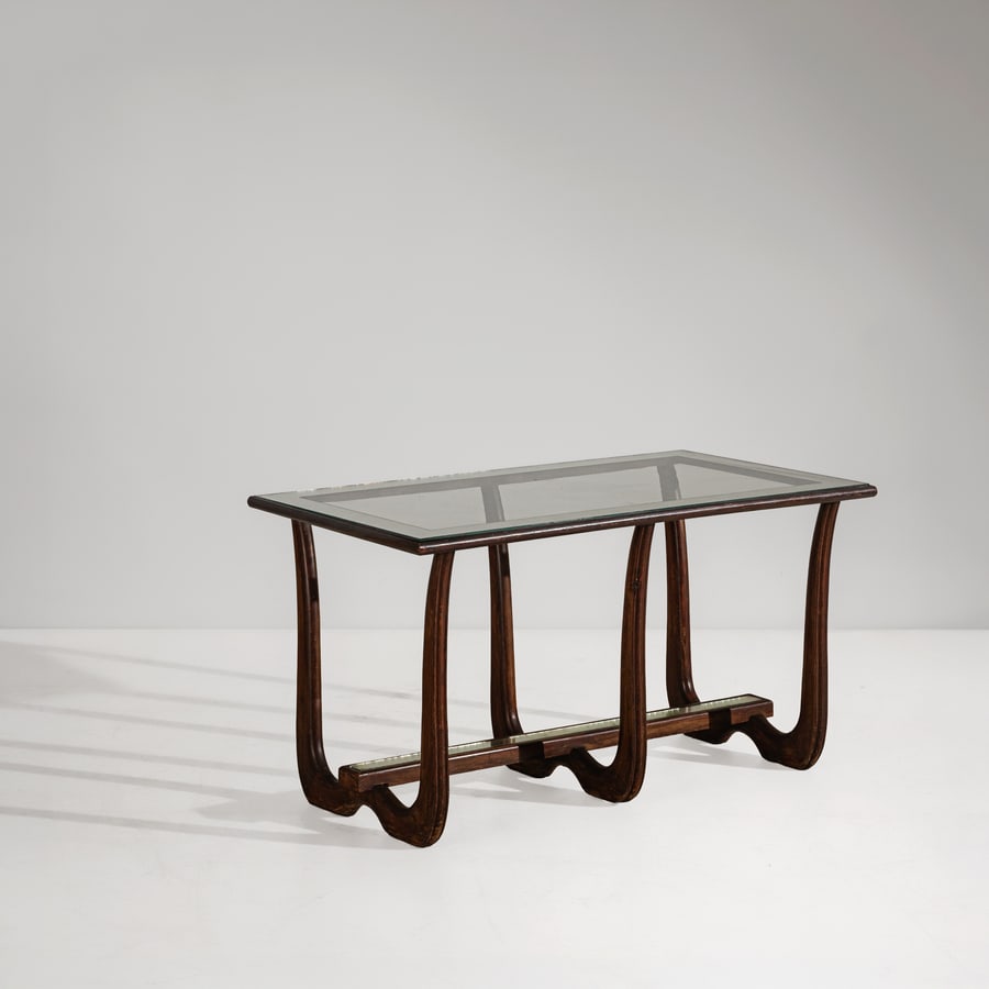 OSVALDO BORSANI (ATTRIB. A): Tavolino. Legno tinto, cristallo molato e parzialmente specchiato. Italia, anni '40. cm 56x102x57 A COFFEE TABLE ATTRIBUTED TO O. BORSANI Buone condizioni generali. Piccole righe, leggeri graffi,