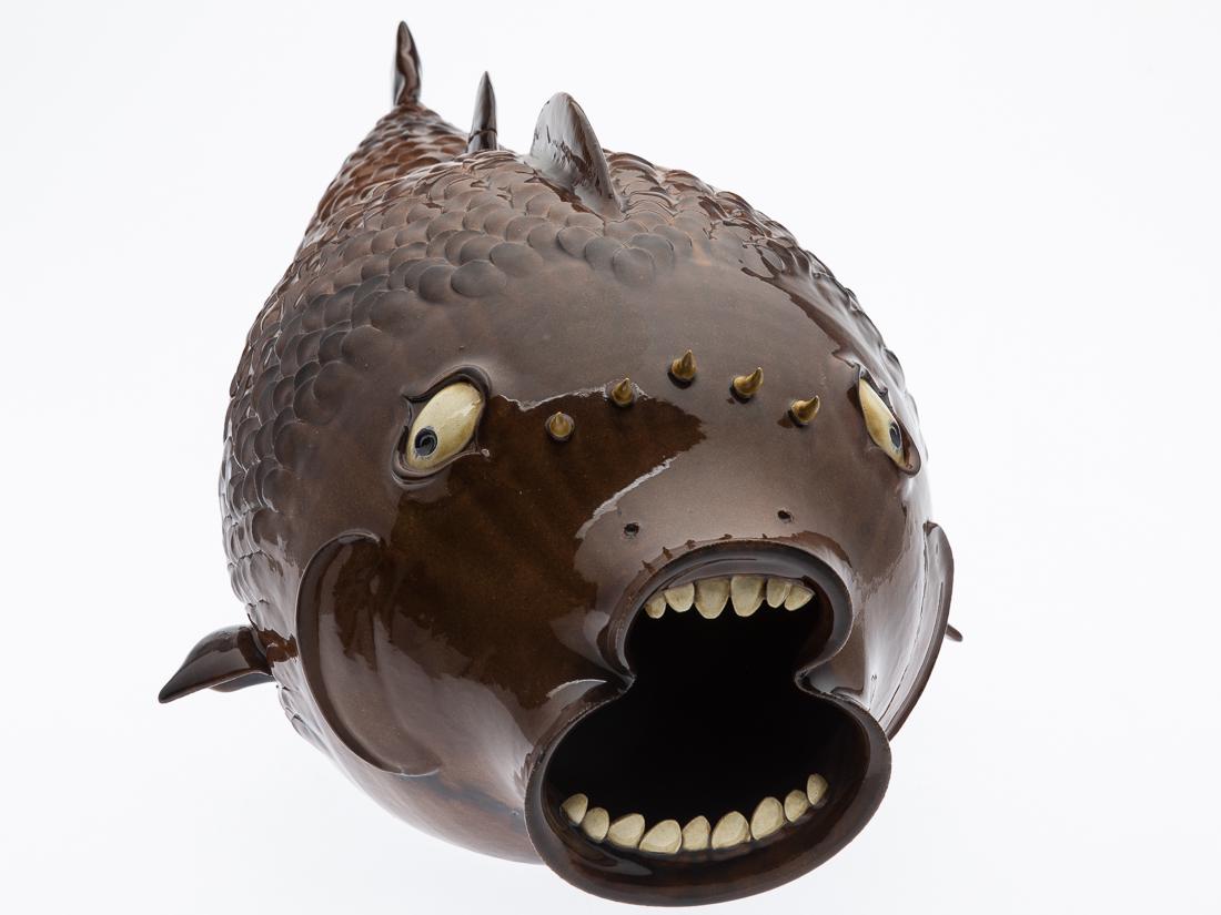 Large Roger Corn Fish: Property from a Private Collection, Georgia ceramic vessel, signed on base "#7, Horney Head by Roger Corn, Banks County, GA, 2001." H. 10 1/2 in. x W. 23 in. x D. 12 1/2 in. Roger Corn is a traditiona