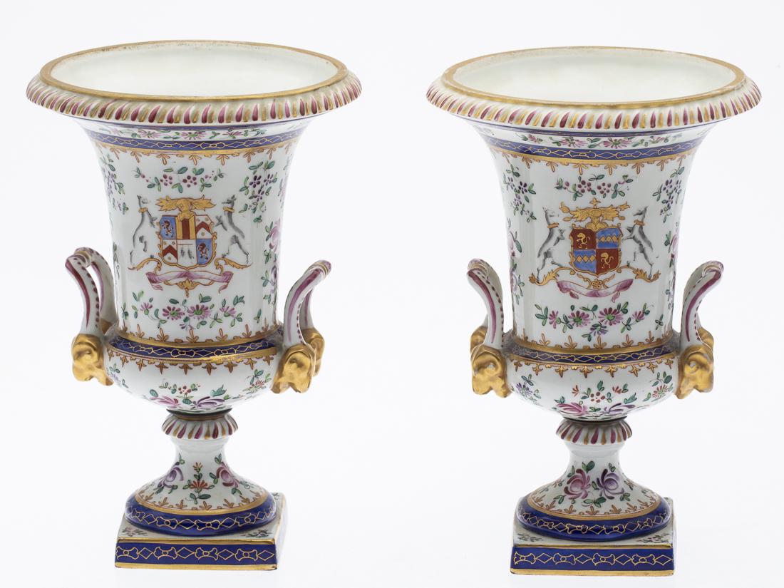 Pair of Samson Porcelain Urns, 19th Century: Property from the Estate of Judie Weiss Formerly in the Collection of Moses Weiss, NYC each with armorial crest and floral decoration, mounted on the sides with carrying handles. H. 10 in. x W. 17 in.