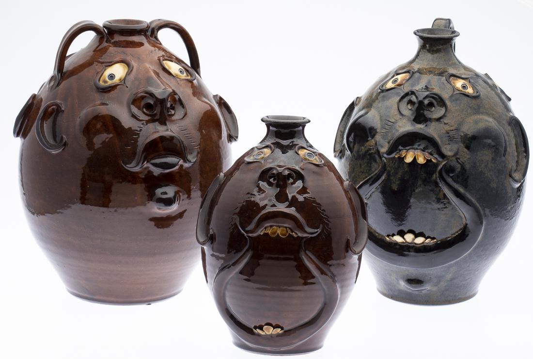 3 Roger Corn Face Jugs: Property from a Private Collection, Georgia all signed on bottom, the blue one signed "#3/10, Four Eyed Jug by Roger Corn, Banks County, GA, 2003," the largest signed "Roger Corn, Banks County, GA, 20