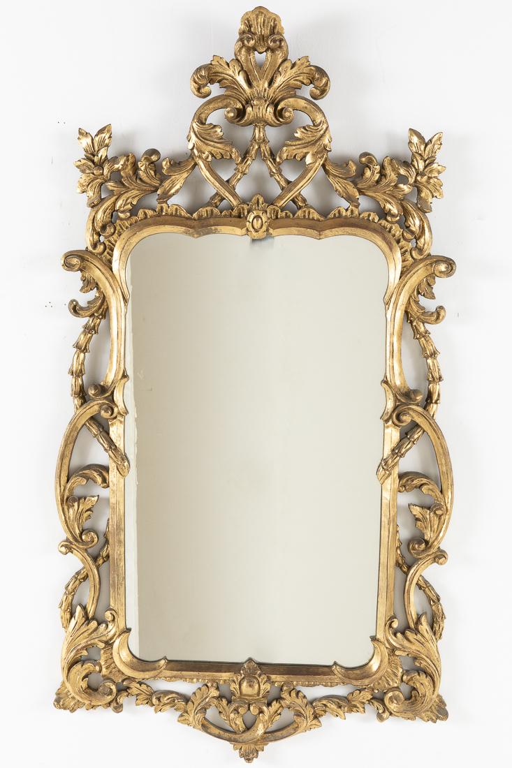 Italian Rococo Style Giltwood Mirror: Property from a Florida Estate 20th Century, the rectangular mirrorplate with a foliate-scrolled frame. H. 52 in. x 28 in.