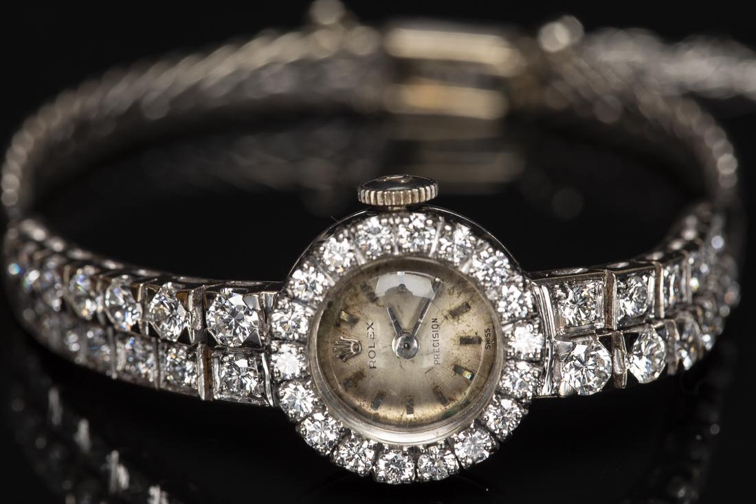 Rolex White Gold and Diamond Ladies Watch: Property from the Collection of Lady Grundy Cocoa Beach, Fl. Rolex White Gold and Diamond Ladies Watch, stamped 750, approx. 3 carats of diamonds, H color VS1/2, 15dwt overall. Diameter of watch face