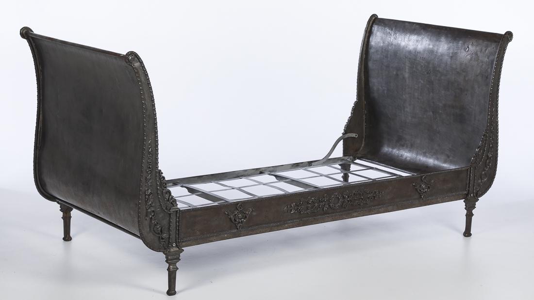 Continental Steel Daybed, 19th Century: Property of a Private Collection, Hilton Head, SC with curved metal ends and front rail decorated with bunches of grapes and leaves. H. 38 in. x W. 6 ft. 1 in. x D. 36 in.