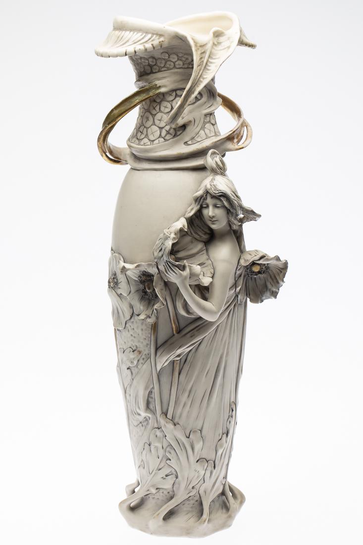 Art Nouveau Royal Dux Porcelain Vase: Property from a South Carolina Collector decorated with woman and flowers, marked 'Royal Dux Bohemia 935' on base. H. 21 in. x W. 11 1/4 in. D. 4 3/4 in.