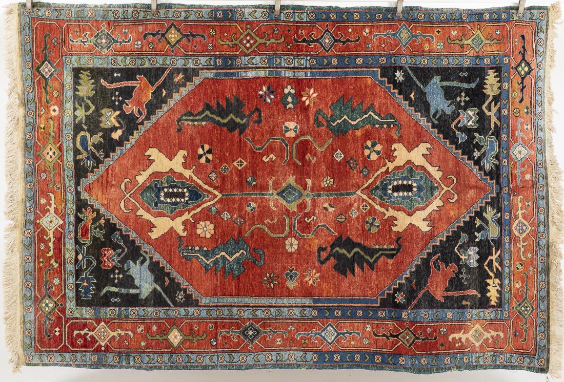 Turkish Wool Rug: Property from a Private Collection, Hilton Head Island, SC in tones of navy, light blue, green, and cream on a rose ground. H. 8 ft. 7 in. x W. 5 ft. 11 in.