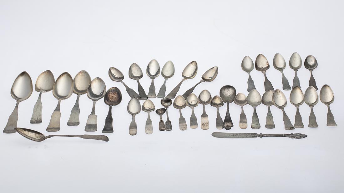 36 Pieces of Miscellaneous Coin Silver Flatware: Property from a Private Collection Savannah, GA comprising 5 large serving spoons, 3 various small serving spoons, 1 butter knife, 6 teaspoons, 17 dessert spoons, and 2 salt spoons, all with various m