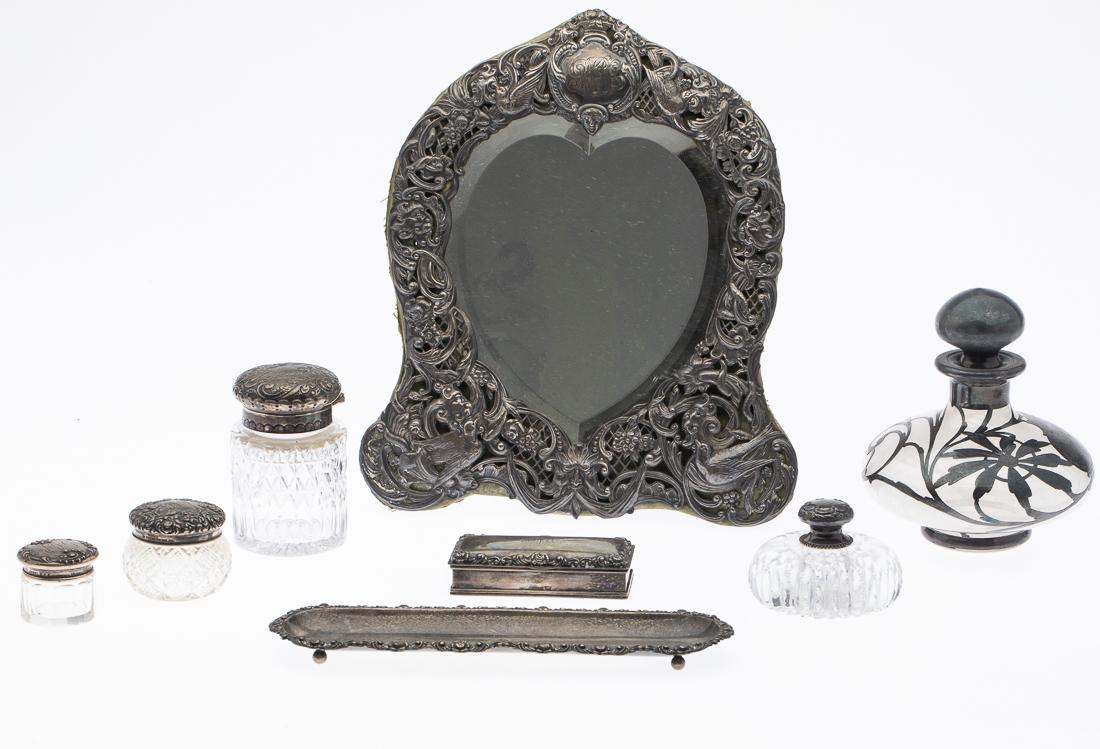 Group of 8 Sterling & Glass Dressing Table Articles: Property from a Savannah, GA Estate comprising one heart shaped table mirror with monogram, unmarked; Wilcox Co. box marked 'sterling' with monogramed top, Wilcox Co. long tray marked 'sterling' with 