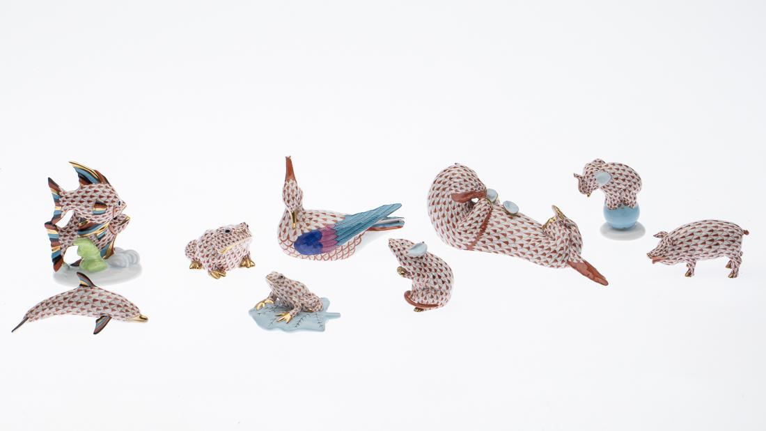 9 Herend Porcelain Animals: Property from a Savannah, GA Estate comprising an otter, elephant, mouse, two frogs, pig, fish, dolphin, and a bird, all marked 'Herend Hungary Handmade' with incised ID number. Size of otter: H.