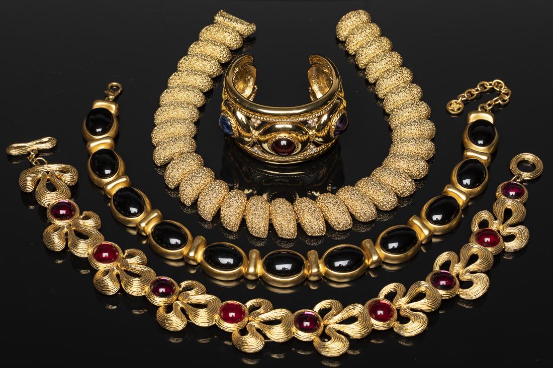 Group of Costume Jewelry Including Givenchy: Property from a Savannah, GA Estate cuff bracelet marked "Givenchy", pink and red necklace marked "Givenchy", black necklace marked "Givenchy" and unmarked gold tone necklace. length of all necklaces 