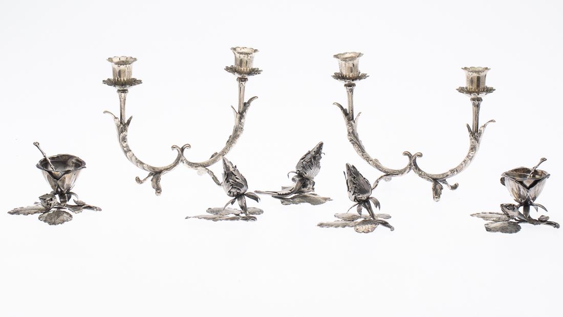 Continental Silver Candelabras & 5 Salt and Peppers: Property from the Estate of Judie Weiss Formerly in the Collection of Moses Weiss, NYC comprising a pair of candelabras marked 800, 2 silver plate floral salts with removable liner and salt spoons, 3 