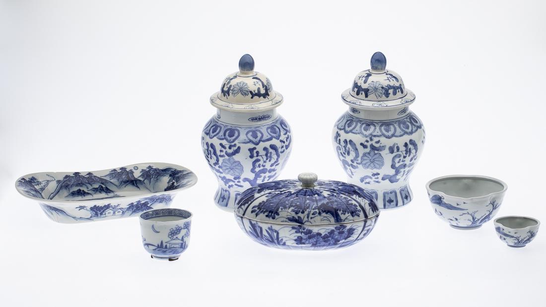 Group of 7 Chinese Blue & White Decorative Articles: Property from a Savannah, GA Estate modern, comprising a pair of lidded urns, an oval bowl (chip to rim, broken and glued), oval lidded bowl (frits to base), two small shaped bowls and one cup. Height