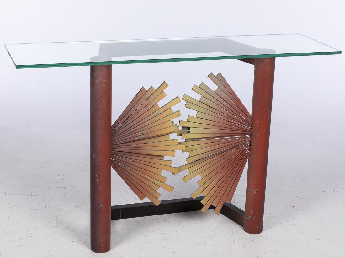 John Bucci, Red Metal Sunburst Console Table Base: (Illinois, 1935-2019), with sunburst base and red uprights, GLASS TOP NOT INCLUDED. H. of base 29 in. x W. 28 in. x D. 12 in. John Bucci, who worked from a studio in Chicago, created concept cars, one