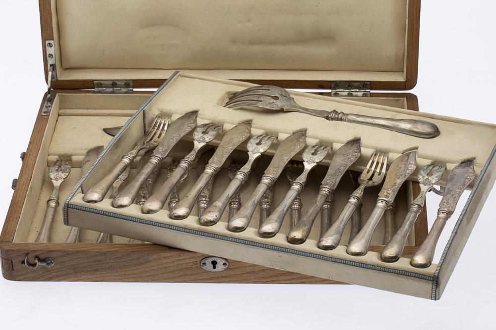 Austrian Sterling Silver Fish Set: Property of a Private Collection, Savannah, GA comprising 12 fish forks, 12 fish knives, a serving fork and a large fish knife, all with Austrian hallmarks. 46.26 troy. Length of serving fork: 9 1/4 i