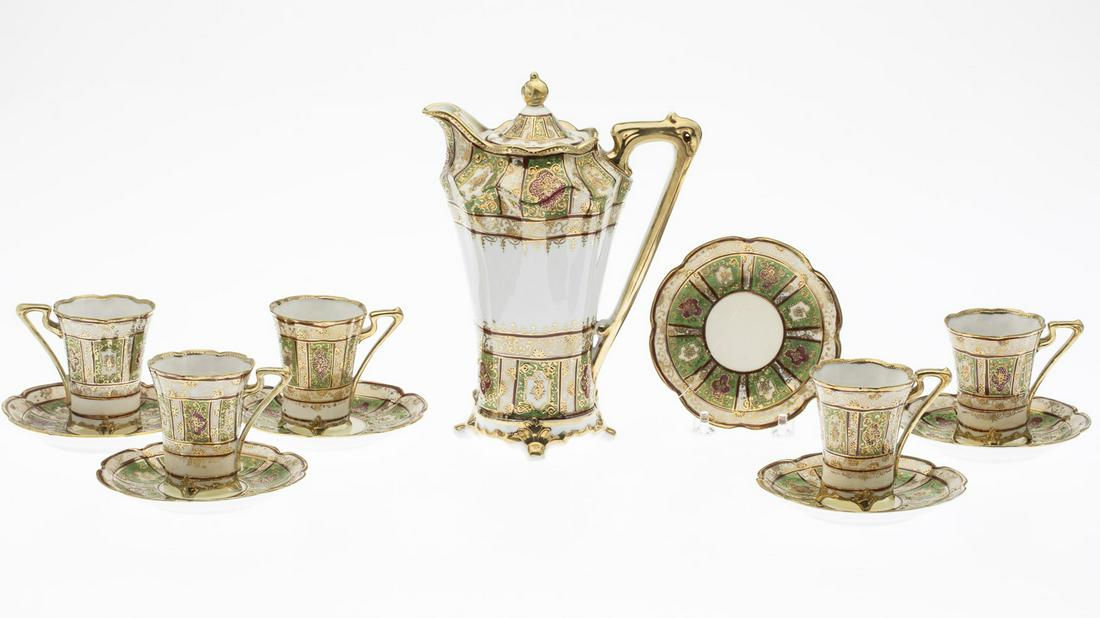 Nippon Porcelain Coffee Service: Nippon Porcelain Coffee Service, 20th century, comprising a coffee pot (with hairline crack on interior rim of lid and wear to gilt on handle and spout), 5 cups (one with hairline crack from rim, two 