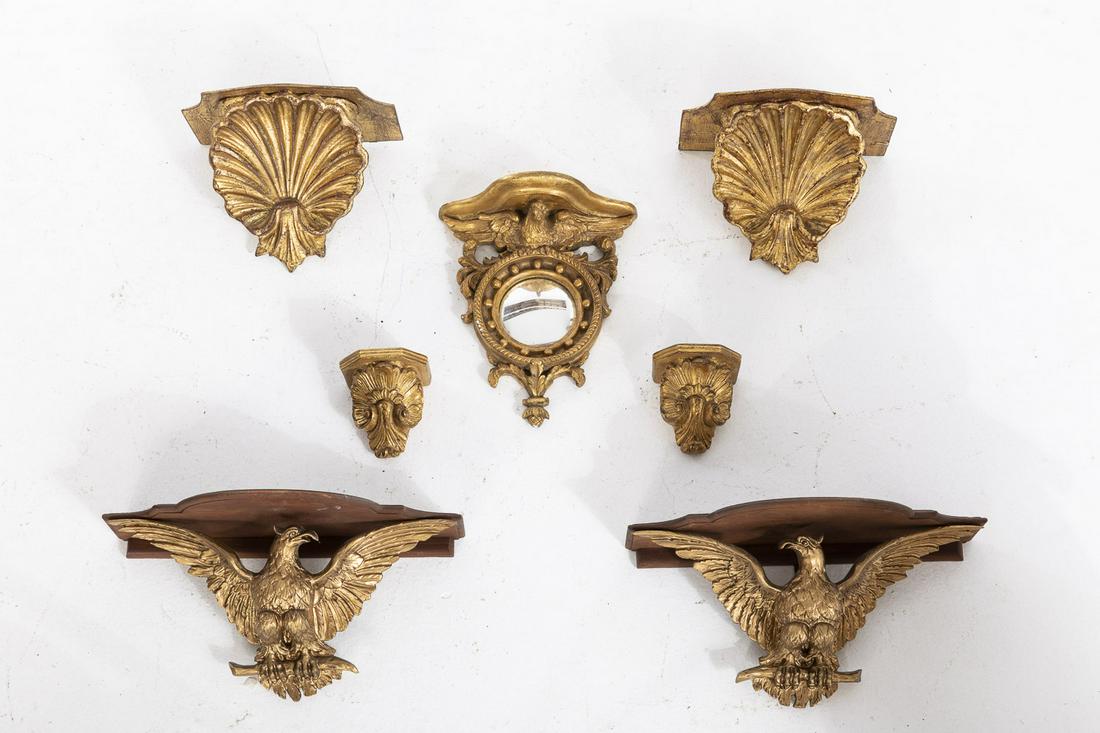 7 Modern Gilt Wall Brackets: 7 Modern Gilt Wall Brackets, comprising a pair of wood and plaster eagle-form brackets (marked 'Made in Italy, Made for Seargan Schepps, Park Avenue, New York' on back'), a pair of giltwood shell-form
