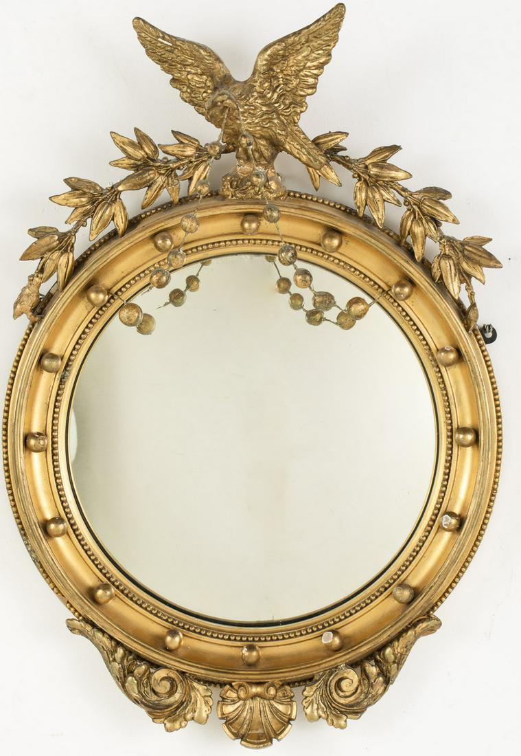 Regency Style Giltwood Convex Mirror, 20th Century: Regency Style Giltwood Convex Mirror, 20th Century, with eagle and branch-form crest. MEASURMENTS: Height: 26 3/8 in. x Width: 18 in.