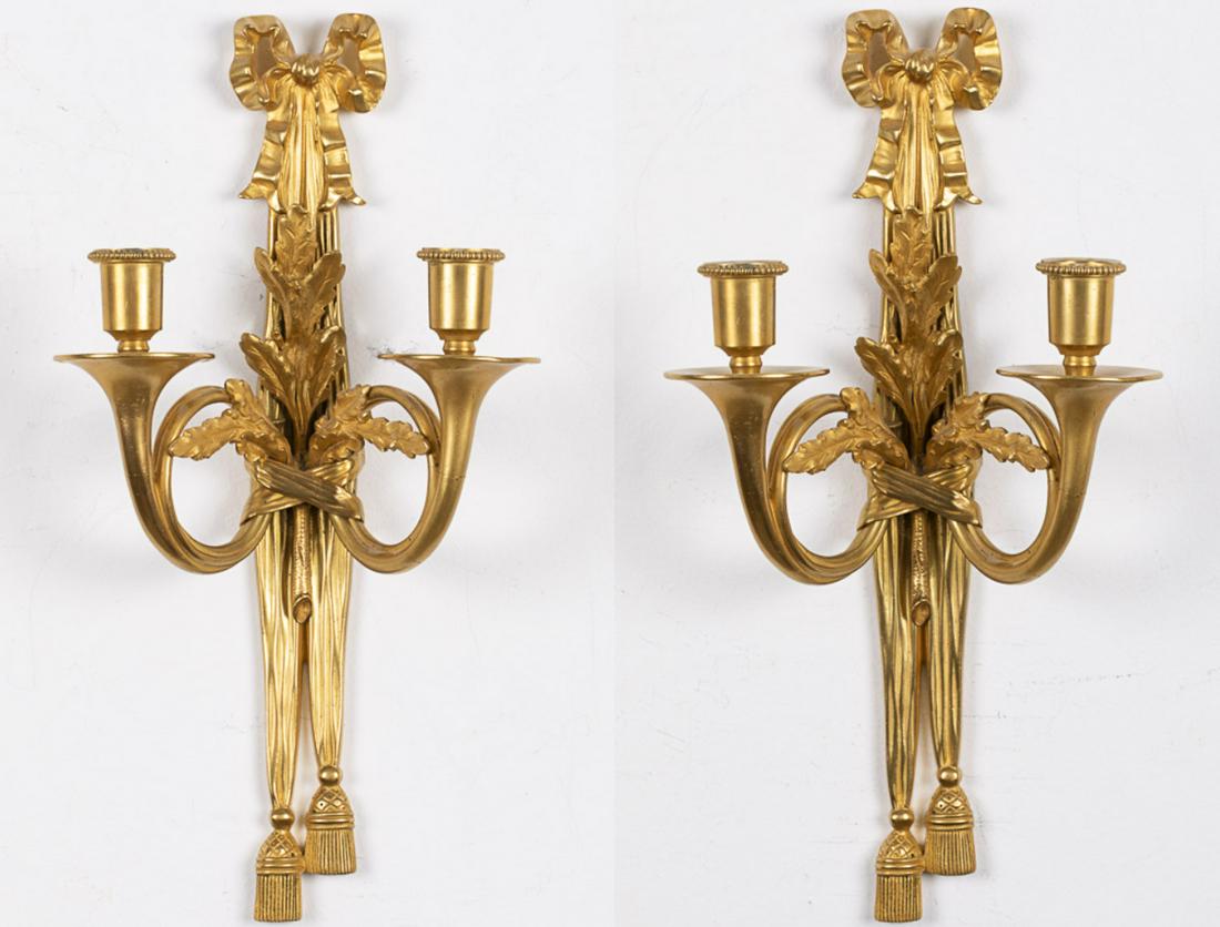 Pair of Two Light Gilt-Metal Wall Sconces, Modern: Pair of Two Light Gilt-Metal Wall Sconces, Modern, each with bow and oak leaf decoration with trumpet form arms. MEASURMENTS: Height: 16 1/2 in. x Width: 9 in. x Depth: 4 1/2 in.