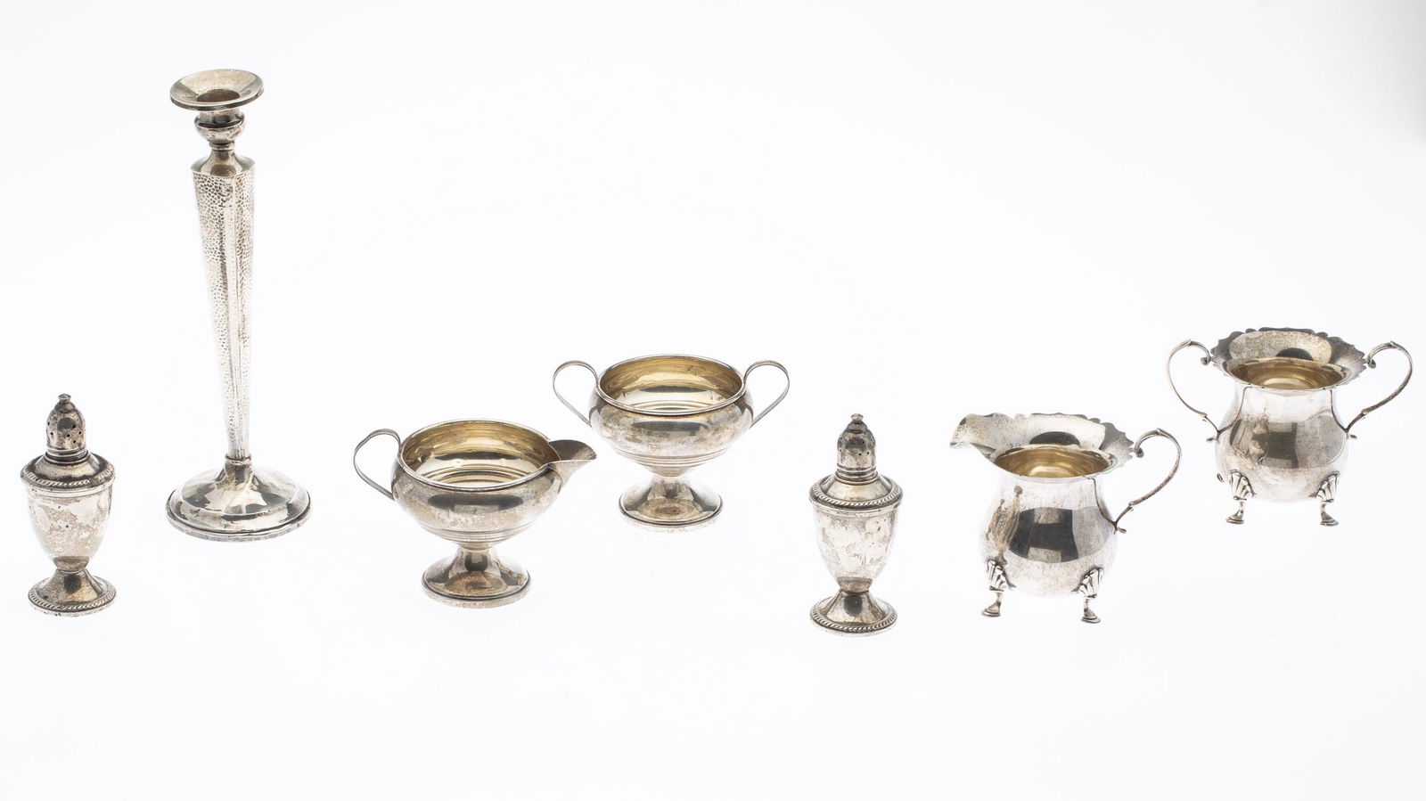 Group of Sterling Silver: Group of Sterling Silver, comprising a cream and sugars (one pair marked for Mueck Sterling, the other marked 'Sterling'), a Hunt Silver Co. weighted candlestick, and Duchin salt and pepper. 11 troy o