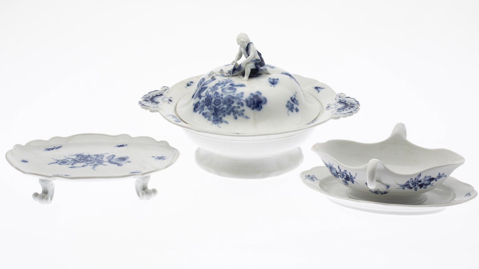 Meissen Tureen, Gravy Boat and Footed Tray: Meissen Tureen, Gravy Boat and Footed Tray, comprising a lidded tureen with child on lid (chips to both handles and two small hairline cracks on rim of lid), a gravy boat with attached dish (chips to 