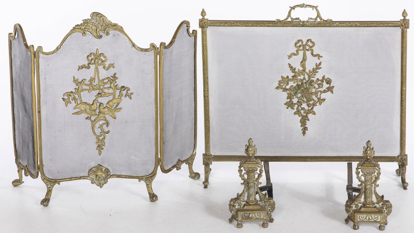 Two French Fire Screens & a Pair of French Andirons: Two French Fire Screens and a Pair of French Andirons, comprising a pair of columnar andirons decorated with cornucopia (Height: 13 1/2 in. ), a rectangular firescreen with central handle and mesh ins