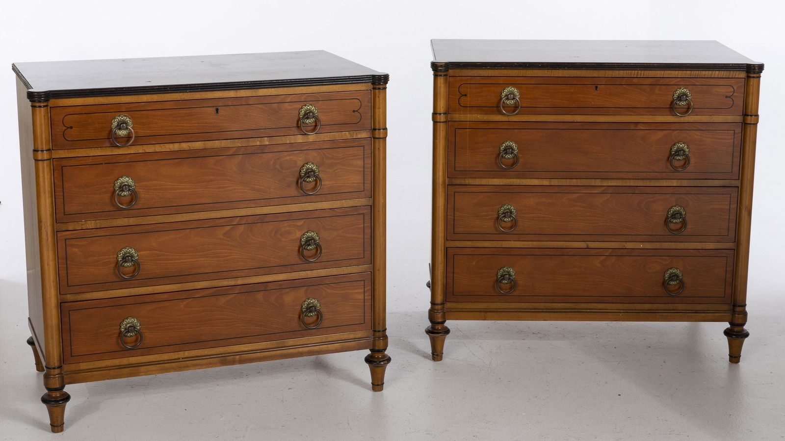 Pair of French Style Kittinger Satinwood Chests of: Pair of French Style Kittinger Satinwood Chests of Drawers, each with rectangular tops with ovolo corners above a divided top drawer with Kittinger brand mark, over three drawers raised on turned tape