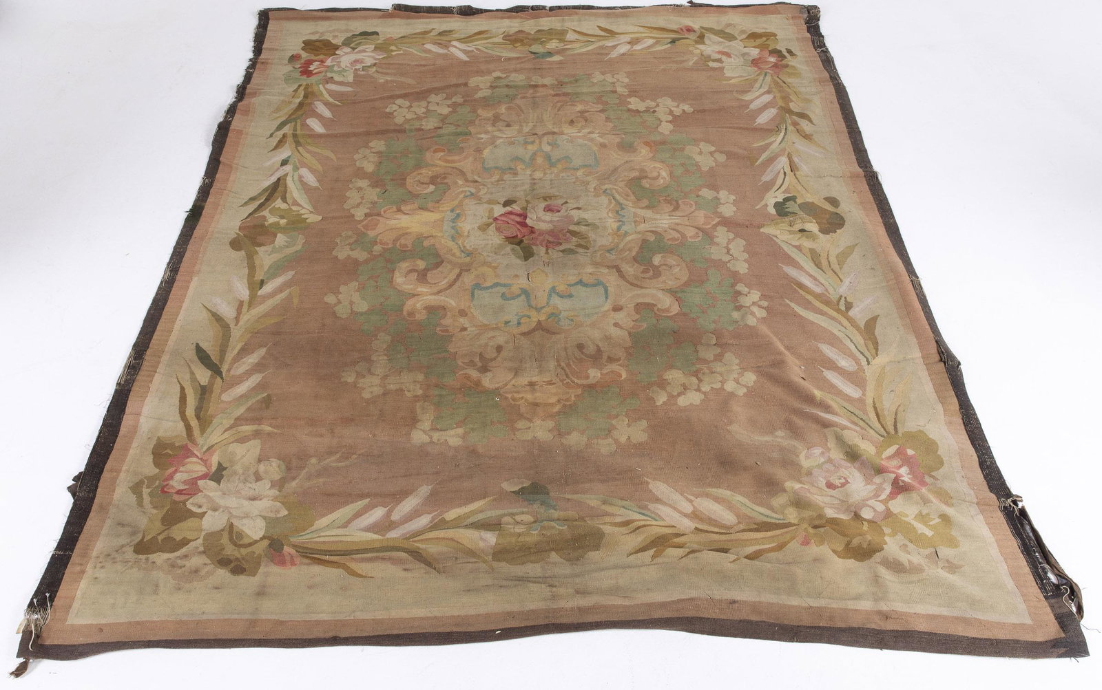 Aubusson Carpet: Aubusson Carpet, 19th Century, in tones of pink, green, and cream, on a beige ground. MEASURMENTS: Length:10 ft. 3 in. x Width: 8 ft. 10 in.