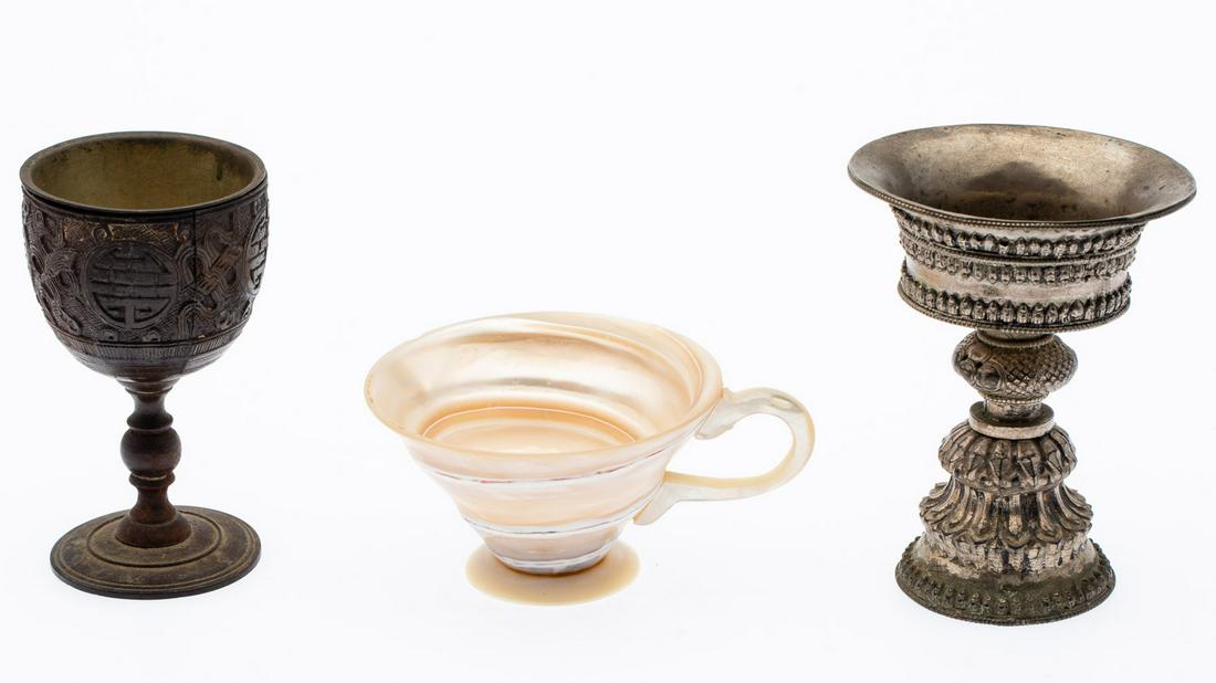 3 Unusual Stone, Wood and Metal Cups: Property of a Florida Collector Description: 3 Unusual Stone, Wood and Metal Cups, comprising a mother-of-pearl tea cup, SE Asian silvered metal cup and a carved wood cup with metal insert.