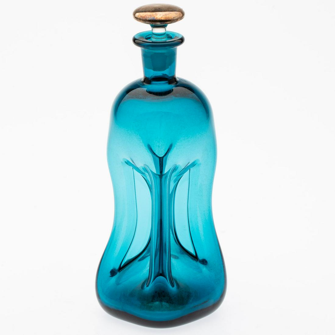 Blue Holmegaard Kluck Kluck Decanter, c. 1960s: Property from a Kentucky Private Collection Description: Blue Holmegaard Kluck Kluck Decanter, c. 1960s, unmarked, with an associated stopper. Measurements: Height: 10 1/4 in. x