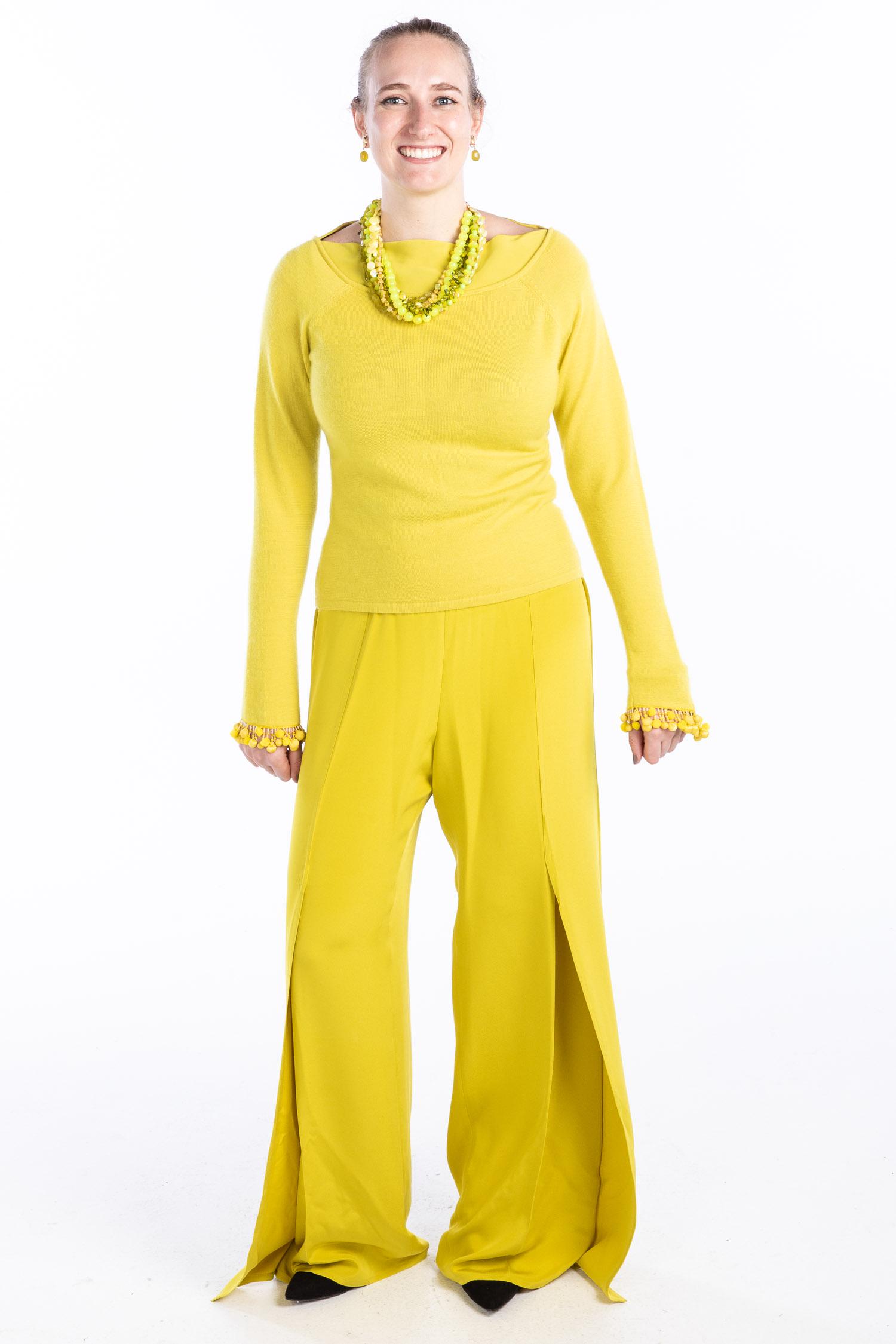 Naeem Khan Citron Sweater and Panel Pants: Clothing and Accessories from the Estate of Jeanne Robertson Description: Naeem Khan Citron Sweater and Panel Pants, a Naeem Khan citron silk crepe and cashmere sweater with bead and pom-pom cuffs