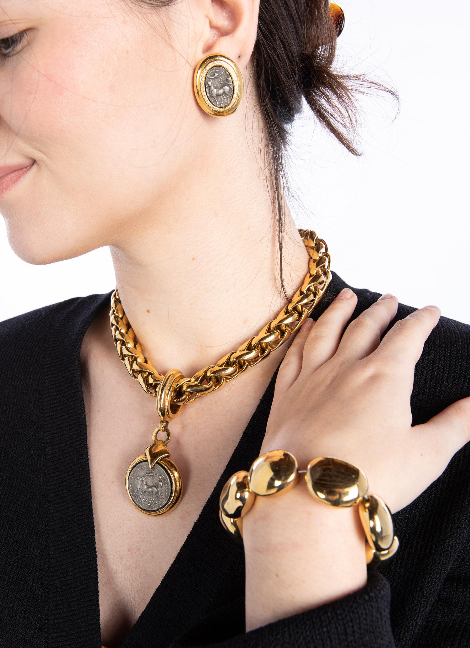 Jose & Maria Berrera Necklace, Earrings and Bracelet: Clothing and Accessories from the Estate of Jeanne Robertson Description: Jose & Maria Berrera Necklace, Earrings and Bracelet, comprising a Jose and Maria Barrera gold-tone chain necklace with 1