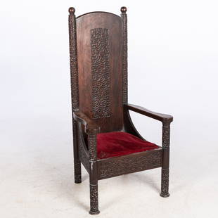 Attr. Lockwood de Forest Elaborately Carved Armchair: Property from the Collection of Alex Raskin, Savannah, GADescription: Oak Armchair Attributed to Lockwood de Forest, with elongated back flanked by open arms centering an upholstered seat raised on