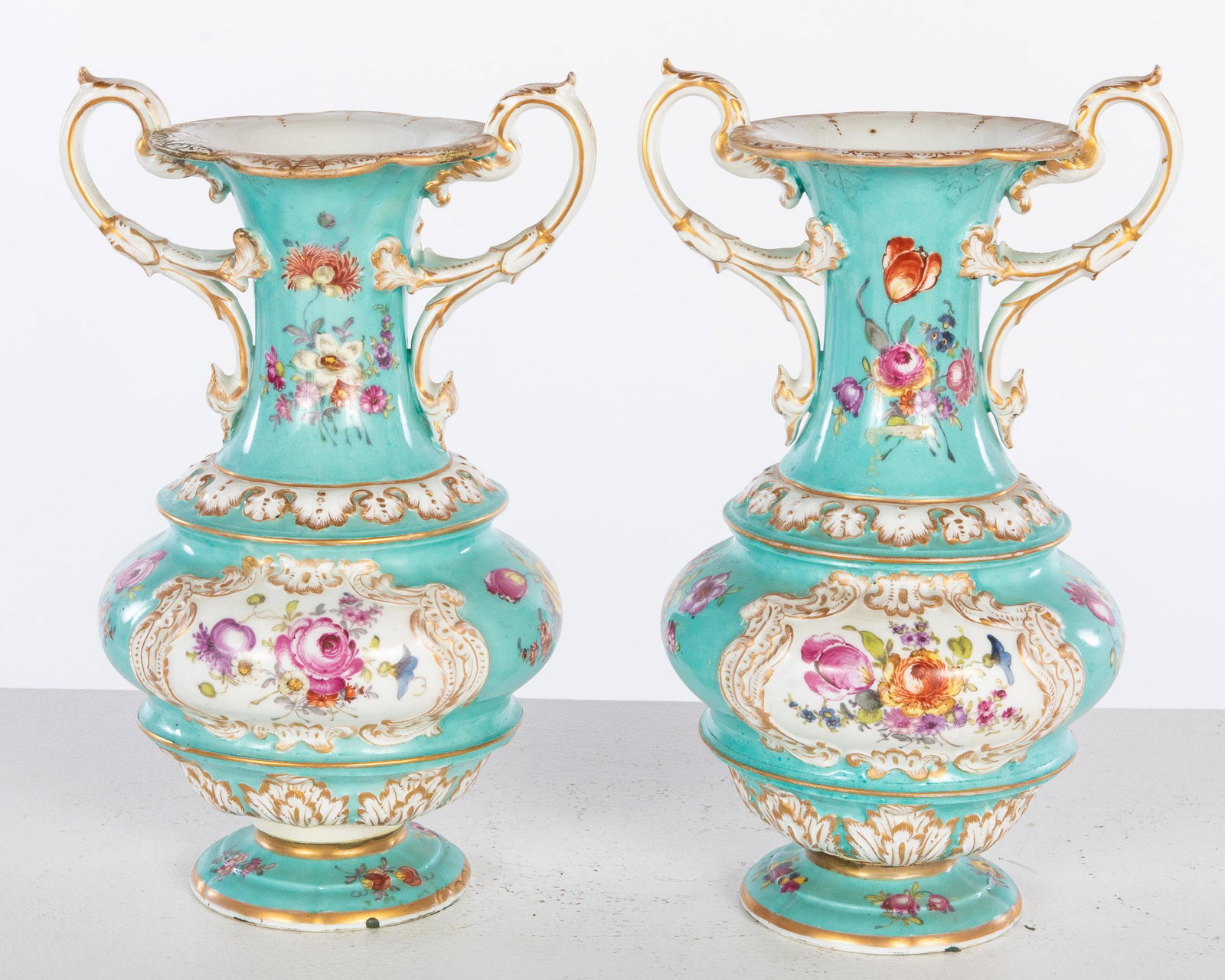 Pair of European Turquoise and Floral Vases, 19th C: Property from a Savannah, GA Estate Description: Pair of European Turquoise and Floral Vases, 19th Century, a pair of turquoise, gilt, and floral decorated vases, both with Meissen double crossed
