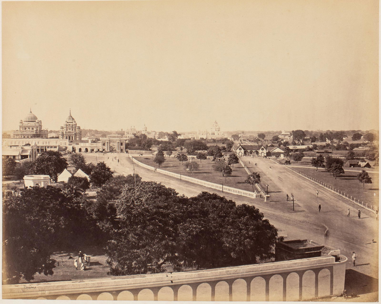 Samuel Bourne Albumen Photograph, Lucknow: Description: Samuel Bourne Albumen Photograph, Lucknow, signed 'Bourne' lower left, mounted, inscribed in border 'Oudh Exhibition and surrounding scenery Lucknow', pencil numbered '185' on verso