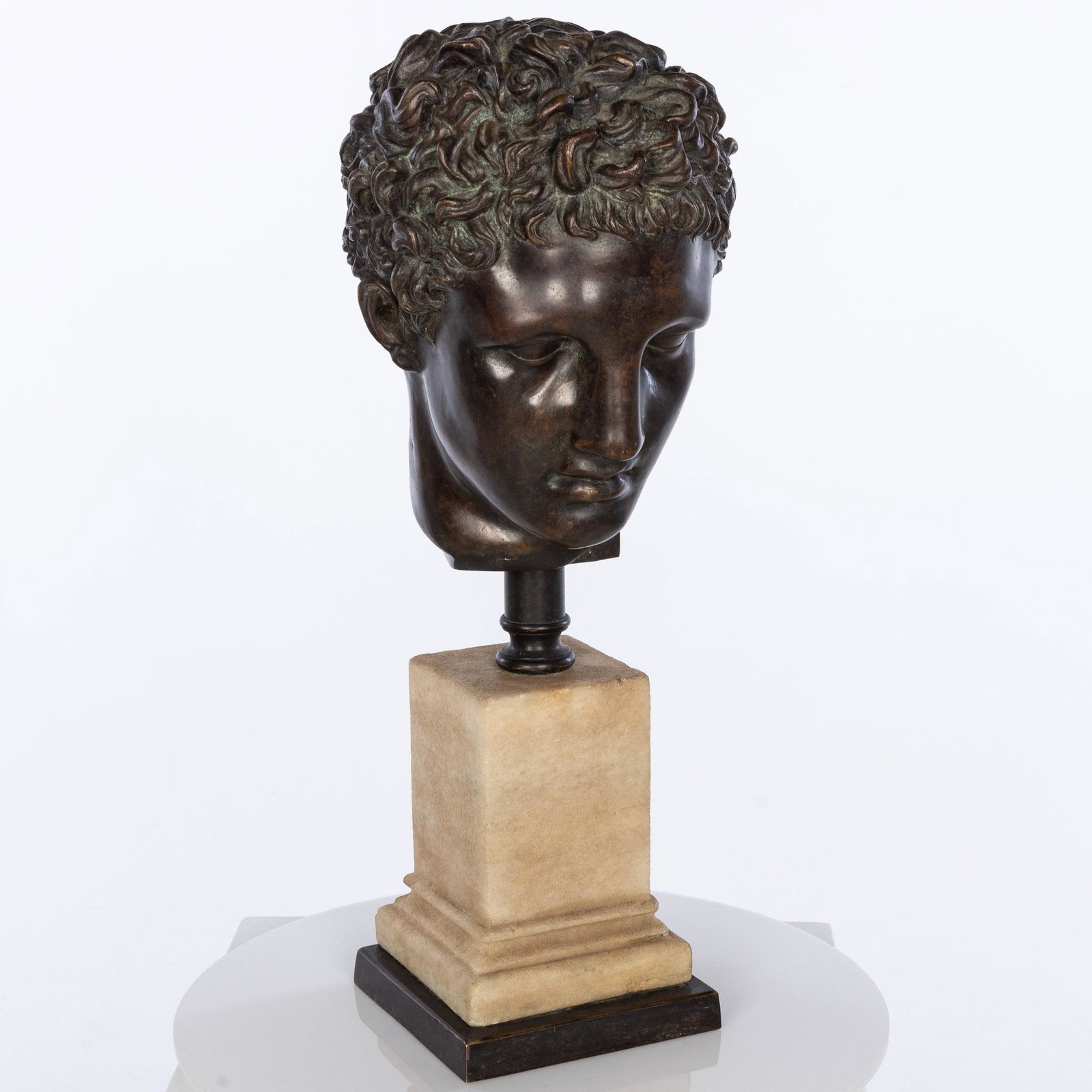 Bronze Head After the Antique: Property from the Collection of John and Virginia Duncan, Savannah, GA Description: Bronze Head After the Antique, the head mounted to a marble base. Measurements: Height: Overa